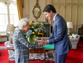 A maskless Trudeau meets Queen Elizabeth II on March 7, 2022.