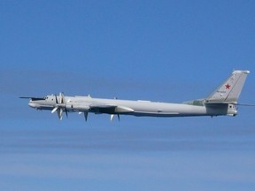 A file photo of a Russian TU-95 bomber flying over East China Sea in 2019. Joint Staff Office of the Defense Ministry of Japan/HANDOUT via REUTERS.
