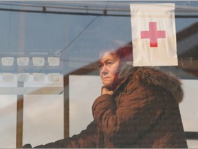 A woman is seen inside a bus before departing from a temporary accommodation centre for evacuees during Ukraine-Russia conflict in the village of Bezimenne in the Donetsk Region, Ukraine May 1, 2022.