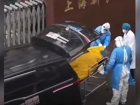 Morgue workers discover and elderly Chinese man in body bag is still alive. Source: Chinese social media