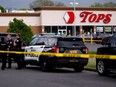 Police officers secure the scene after a shooting at Tops supermarket in Buffalo, New York, U.S. May 14, 2022.