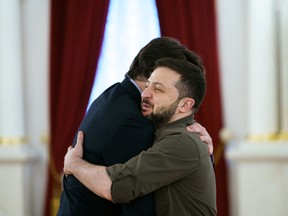 Prime Minister Justin Trudeau, left, embraces Ukrainian President Volodymyr Zelenskyy, in Kyiv, on May 8.