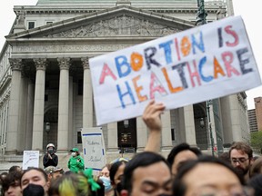 People protest after the leak of a draft majority opinion written by U.S. Supreme Court Justice Samuel Alito, preparing for a majority of the court to overturn the landmark Roe v. Wade abortion rights decision, in New York City on May 3, 2022.
