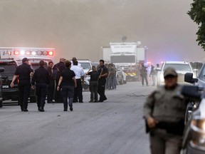 Law enforcement officers work the scene of a mass shooting at Robb Elementary School where at least 18 children and one adult were killed on May 24, 2022 in Uvalde, Texas. The suspected gunman, identified as 18-year-old Salvador Ramos, was reportedly killed by law enforcement.