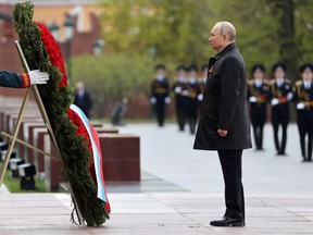 Russian President Vladimir Putin takes part in a wreath-laying ceremony at the Tomb of the Unknown Soldier on Victory Day, which marks the 77th anniversary of the victory over Nazi Germany in World War Two, in central Moscow, Russia May 9, 2022.