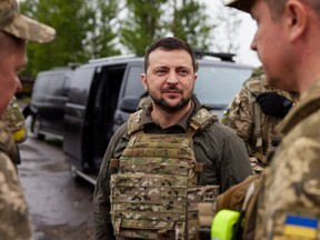 Zelenskyy took a surprise trip to Kharkiv, wearing a bulletproof vest, and met with troops.