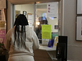 A woman stands at the check-in window of the Hope Medical Group for Women in Shreveport, Louisiana, April 19, 2022.