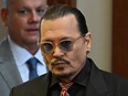 Johnny Depp arrives in the courtroom at the Fairfax County Circuit Court in Fairfax, Virginia, on May 3.