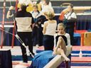 In this 2002 image courtesy of Amelia Cline, gymnast Amelia Cline at the 2002 National Championships in Winnipeg, Canada. 