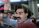 Sacha Baron Cohen dressed as his alter ego 'Borat' wears a traditional Australian bush hat at the Australian premiere of his film, 'Borat!  Cultural Learnings of America for Make Benefit Glorious Nation of Kazakhstan,” in Sydney, November 13, 2006. / PHOTO BY TORSTEN BLACKWOOD/AFP VIA GETTY IMAGES