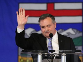 Alberta Premier Jason Kenney speaks in response to the results of the United Conservative Party leadership review in Calgary on Wednesday May 18, 2022. The chair of the United Conservative caucus says members have decided that Kenney should stay on until a new leader is chosen.