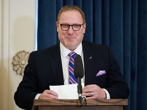 Scott Fielding, minister responsible for liquor and lotteries in Manitoba, is sworn in at the Legislative Building in Winnipeg on Jan. 18, 2022. The Manitoba government is planning to allow more private alcohol sales, including a pilot project that could involve grocery and convenience stores.