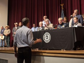 Democrat Beto O"Rourke, who is running against Abbott for governor this year, interrupts a news conference headed by Texas Gov. Greg Abbott in Uvalde, Texas, Wednesday, May 25, 2022.
