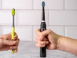 Electric and regular toothbrush in a bathroom. Dental care. Manual toothbrush against modern electric toothbrush concept.