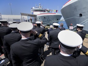 Members of the Royal Canadian Navy salute at a naming ceremony for HMCS Margaret Brooke and HMCS Max Bernays, Arctic and Offshore Patrol Ships (AOPS) at Halifax Shipyards in Halifax on Sunday, May 29, 2022.