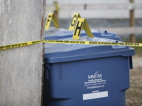 After attending a homicide scene on Edison Avenue in the North Kildonan area of the city on Monday, Winnipeg police investigate at this location on McKay Avenue and other scenes, including a city landfill, Thursday, May 19, 2022.