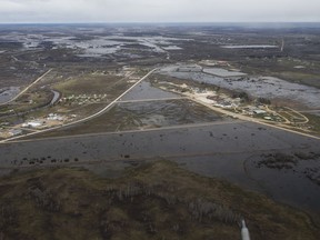 Peguis First Nation with surrounded with Fisher River flood water north of Winnipeg, Sunday, May 15, 2022. Manitoba is expanding a mandatory evacuation and closure area in Whiteshell Provincial Park in the province's east due to flooding.