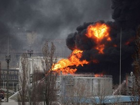 Firefighters operate at an oil refinery which caught fire following a missile attack near the port city of Odesa, amid the ongoing Russia's invasion, in Ukraine, April 3, 2022.