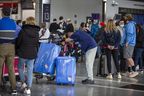 Mustapha Badia (head at rest) arrived nearly seven hours before his flight to Lisbon from Terminal 1 at Toronto's Pearson International Airport on Tuesday, May 3, 2022. Ernest Doroszuk/Toronto Sun/Postmedia