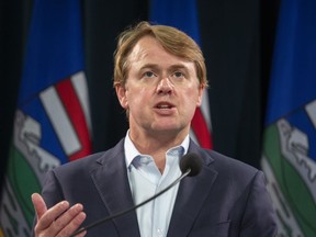 Alberta Justice Minister Tyler Shandro answers questions at a news conference in Calgary on Sept. 3, 2021. Shandro said Thursday the city of Edmonton is failing to keep people safe from violent crime, particularly on public transit, and is ordering Mayor Amarjeet Sohi to provide answers.