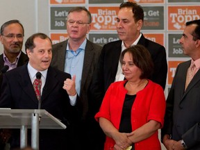 New Democrat MLA Jinny Sims stands next to federal NDP leadership candidate Brian Topp and his other supporters in Surrey, B.C., on Oct. 16, 2011. Sims has announced she's taking an unpaid leave to run for mayor of Surrey in the October municipal election.&ampnbsp;&ampnbsp;THE CANADIAN PRESS/Darryl Dyck