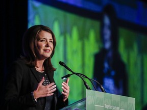 Then-Wildrose leader Danielle Smith addresses party faithful at their annual meeting in Red Deer, Alta., Friday, Nov. 14, 2014. Smith says if she wins the UCP leadership contest, she would create legislation this fall to ignore federal laws along with steps to create an Alberta police force and a provincial agency to collect taxes.