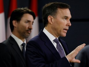 Canada's Minister of Finance Bill Morneau attends a news conference with Prime Minister Justin Trudeau in Ottawa, Ontario, Canada March 11, 2020. REUTERS/Blair Gable/File Photo