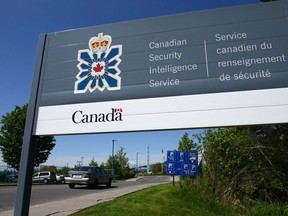 A sign for the Canadian Security Intelligence Service building is shown in Ottawa, Tuesday, May 14, 2013.&ampnbsp;A federal judge has tossed out a Canadian Security Intelligence Service employee's discrimination lawsuit against the spy service, saying Sameer Ebadi should have followed the internal grievance procedure available to him.