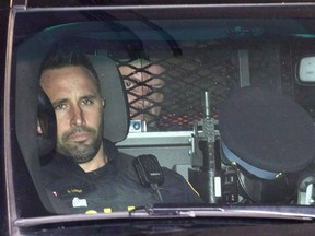 Basil Borutski leaves in a police vehicle after appearing at the courthouse in Pembroke, Ont. on Sept. 23, 2015.&ampnbsp;A coroner's inquest is hearing a review of how probation and parole officers in Ontario handled the file of Basil Borutski before he murdered three of his former partners in 2015.&ampnbsp;THE CANADIAN PRESS/Justin Tang