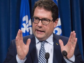 Former Parti Quebecois member Bernard Drainville speaks at a news conference, Friday, April 1, 2016, at the legislature in Quebec City. Drainville is making a return to provincial politics, this time with the Coalition Avenir Québec.