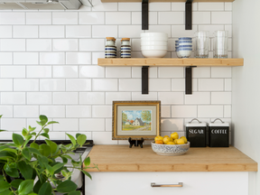Subway tile and open shelves are modern features of the suite. There’s also a full pantry for Linda, an avid cook.