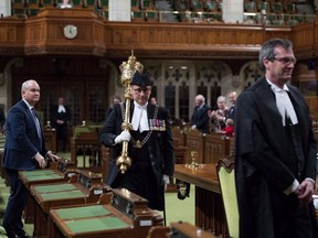 Patrick McDonnell, who was then acting sergeant-at-arms, carries the mace out of the House of Commons Chamber after the House rises, on Parliament Hill in Ottawa on Thursday, Dec. 13, 2018. Parliament's sergeant-at-arms says he was "flabbergasted" at how near-daily harassment of MPs and staffers was allowed to continue under the jurisdiction of Ottawa police during the "freedom convoy."