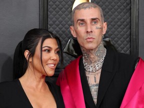 Kourtney Kardashian and Travis Barker pose on the red carpet at the 64th Annual Grammy Awards at the MGM Grand Garden Arena in Las Vegas, Nevada, U.S., April 3, 2022.