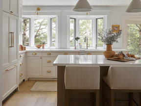 Home tour: Classic coastal in the city - alberta news headlines Reorienting the kitchen so it faces the lush backyard means doing dishes isn’t half bad.