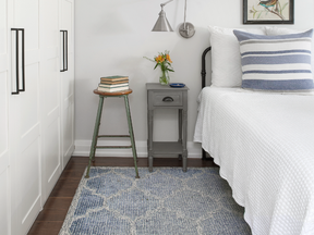 Designer Michelle Hurley added custom wall-to-wall storage in the bedroom “to make sure we used every inch of storage.”