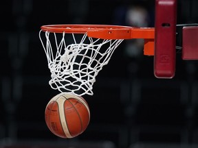 The ball passes through the basket during women's basketball preliminary round game the 2020 Summer Olympics in Saitama, Japan, Monday, Aug. 2, 2021.&ampnbsp;The Canadian women's 3x3 basketball team earned a silver medal at the FIBA World Cup 2022 on Sunday after dropping a 16-13 decision to France.