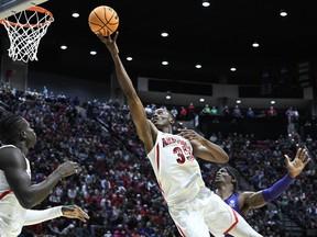 Arizona centre Christian Koloko stretches to put up a shot against TCU during first half second-round NCAA college basketball tournament action, in San Diego, Sunday, March 20, 2022. It's fitting that one of the first people to reach out to Christian Koloko after he was drafted by Toronto on Thursday was new Raptors teammate Pascal Siakam. The two come from the same town of Douala in Cameroon.