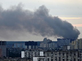 This photograph taken on June 5, 2022 shows smoke after several explosions hit the Ukrainian capital Kyiv early morning. - "Several explosions in Darnytsky and Dniprovsky districts of city. Services are extinguishing," Kyiv Mayor said on Telegram.