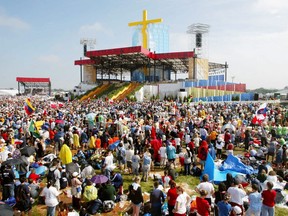 After early morning morning rain, blue skies appear during the World Youth Day papal mass at Downsview Park in Toronto, Sunday July 28, 2002.