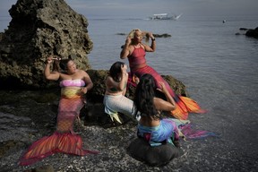 Tabora, right, and her students prepare for a mermaiding class at the Ocean Camp in Mabini.