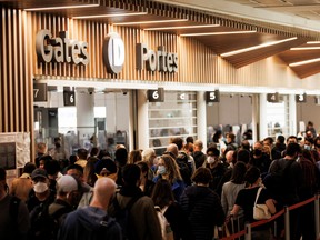 Travelers fill the security line at the departure lounge at Toronto's Pearson International Airport on May 20.