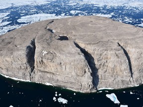 The uninhabited Hans Island, situated at equal distance between Greenland and Canada's Ellesmere Island, is seen in an undated aerial photograph.   John Ells, Geodetic Survey Engineer/Fisheries and Oceans Canada/Handout via REUTERS