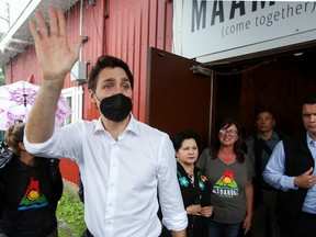 Canada's Prime Minister Justin Trudeau waves as he attends a National Indigenous Peoples Day event at Madahoki Farm in Ottawa on June 21, 2022.