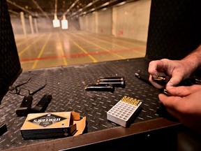 A handgun cartridge is loaded at the Range Langley, after Canada's government introduced legislation to implement a "national freeze" on the sale and purchase of handguns, as part of a gun control package that would also limit magazine capacities and ban some toys that look like guns, in Langley, British Columbia, Canada May 31, 2022.  REUTERS/Jennifer Gauthier