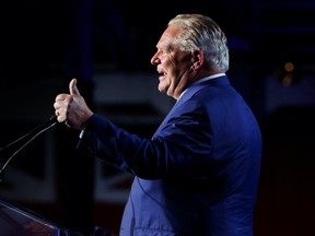 Ontario Premier Doug Ford gestures at his Ontario PC Party provincial election night watch party at the Toronto Congress Centre in Etobicoke, Ontario, Canada June 2, 2022. REUTERS/Carlos Osorio