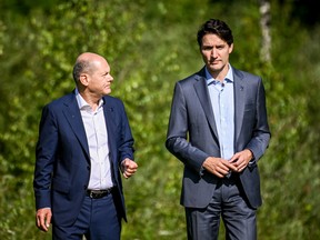 German Chancellor Olaf Scholz (L) meets on the sidelines of the G7 summit in Germany with Canada's Prime Minister Justin Trudeau.