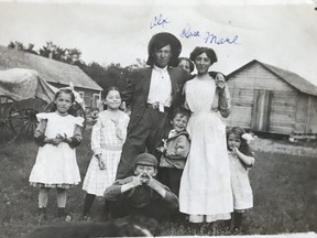 The author's grandfather, Alexandre Hamelin, age 20, at Baie St. Paul, Manitoba. A Red River cart sits in the background.   PHOTO COURTESY SHANNON MONEO