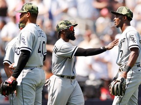 Josh Harrison #5 holds back Tim Anderson #7 of the Chicago White Sox after a benches-clearing dispute over remarks made by Josh Donaldson of the New York Yankees (not pictured) at Yankee Stadium on May 21, 2022 in the Bronx borough of New York City. (Photo by Sarah Stier/Getty Images)