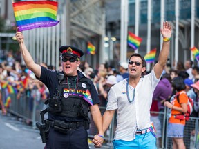 A Hamilton, Ont., police officer marches in the Toronto's Pride parade in 2016, the last year in which uniformed officers were allowed to participate.