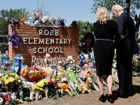 U.S. President Joe Biden and first lady Jill Biden pay their respects at the Robb Elementary School memorial, where a gunman killed 19 children and two teachers in the deadliest U.S. school shooting in nearly a decade, in Uvalde, Texas, U.S. May 29, 2022.